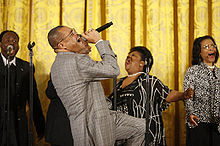 Walter Hawkins performs on stage in the East Room of the White House.jpg