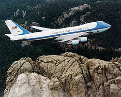 Air Force One flying over Mount Rushmore.