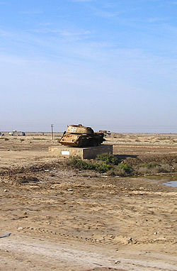 Exploded tank, remains in Abadan as symbol of Iran–Iraq War.jpg